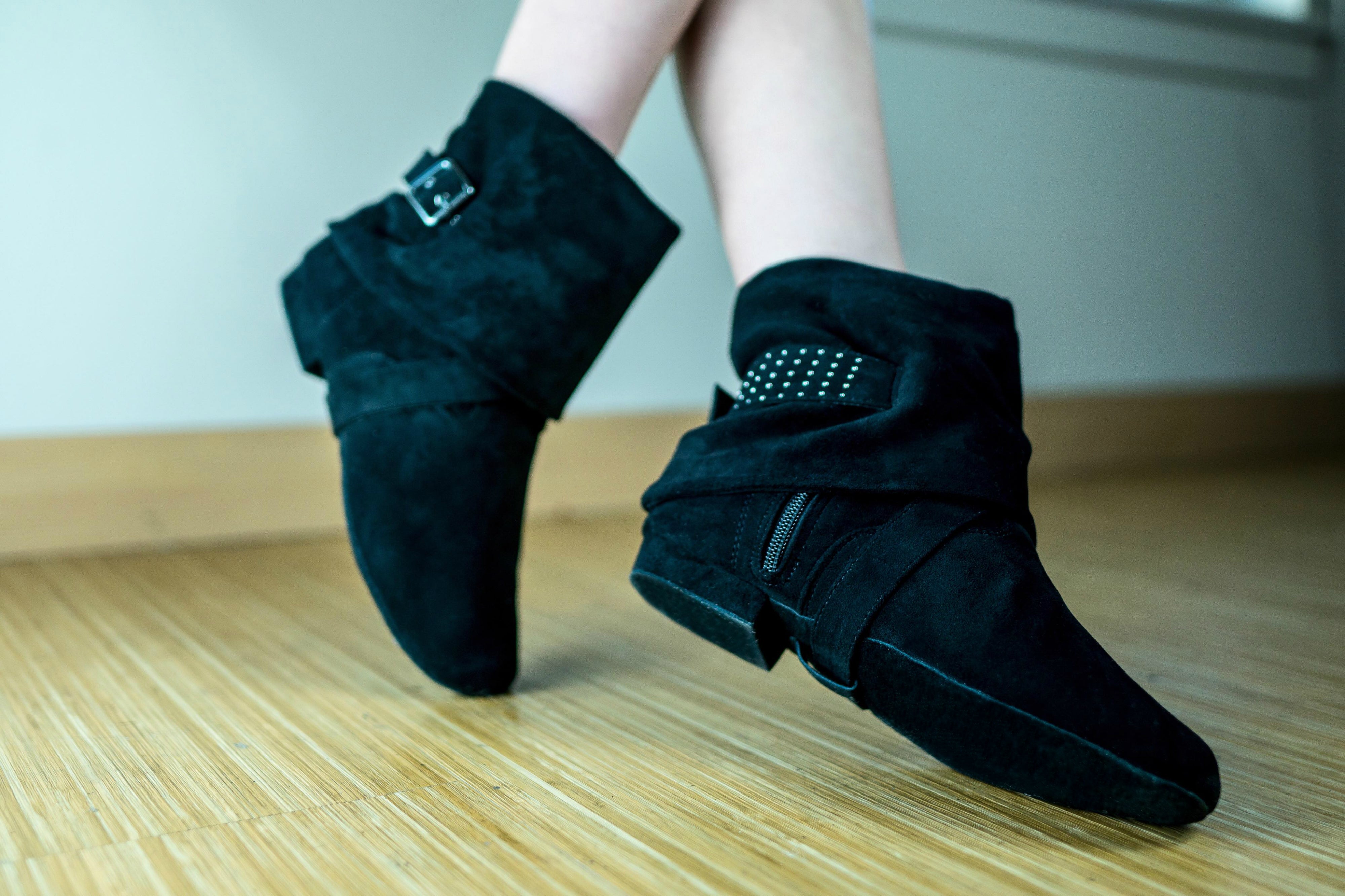 Aurora dance boots black pair folded down angled shot on wood floor