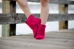 Aurora Dance Boots fuchsia pair with wooden dock background